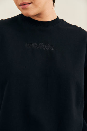 a french terry sweatshirt with front rose embroidery