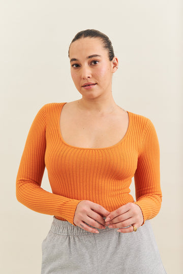 rib knit long sleeve orange body suit made by noon